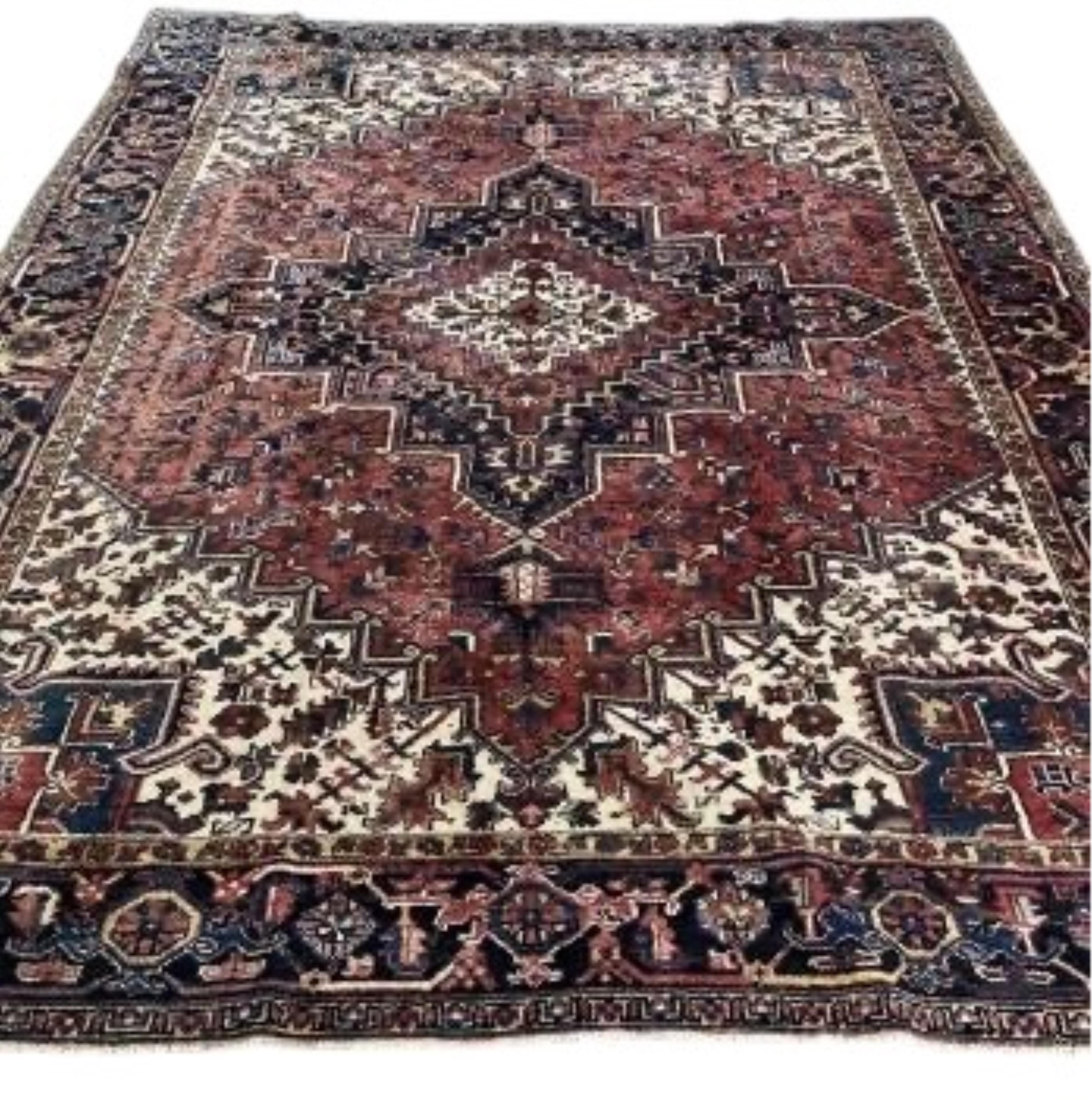A Heriz brick red ground carpet, 330 x 270cm